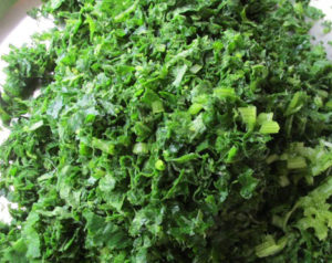 Pumpkin leaves are washed and chopped coarsely with the stems