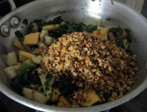 After sauteing the green leaves add veggies and dal